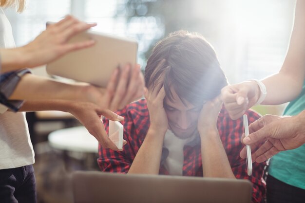 Frustrated business executive sitting in office