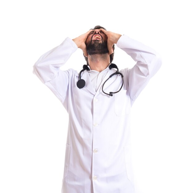 Frustrated doctor over isolated white background