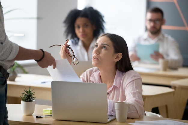 Frustrated employee disagreeing receiving dismissal notice getting fired from job