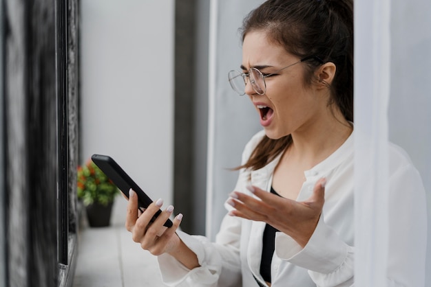 Free photo frustrated girl having a video call