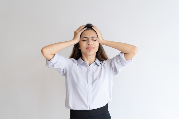 Free photo frustrated girl suffering from head ache