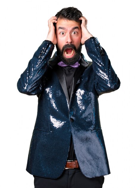 Frustrated handsome man with sequin jacket