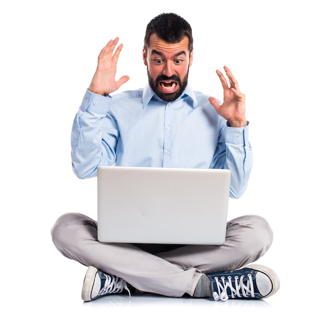 Frustrated man with laptop