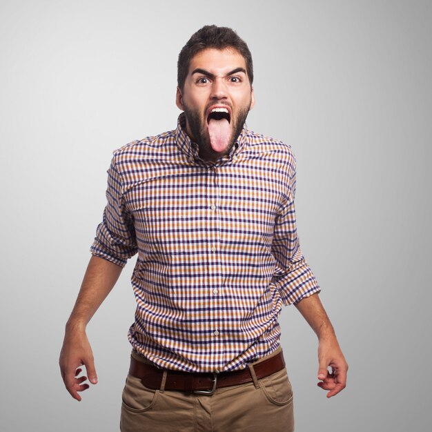 Frustrated man with tongue out