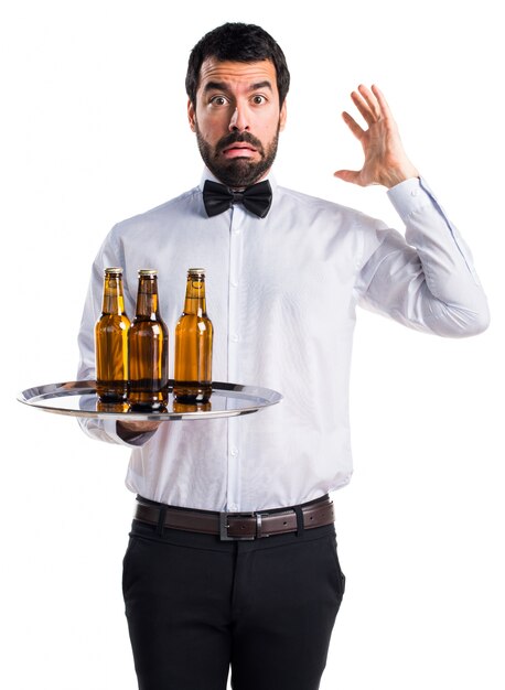 frustrated waiter with beer bottles on the tray