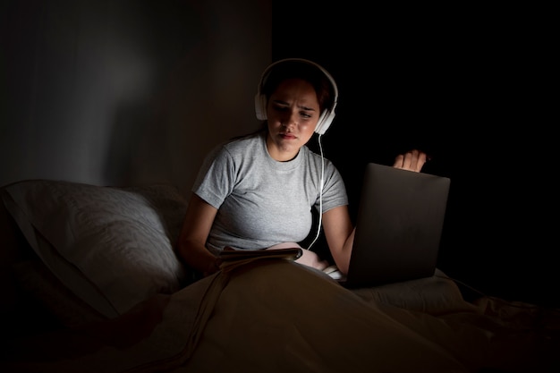 Frustrated woman working late at home