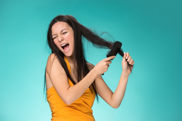 Free photo frustrated young woman having a bad hair