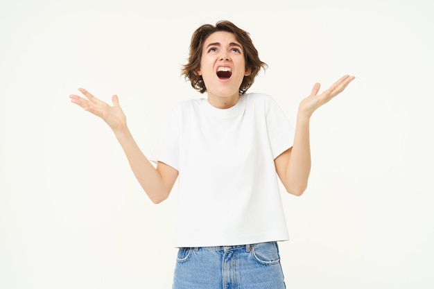 Free photo frustrated young woman looking upset and disappointed complaining screaming from distress and anger