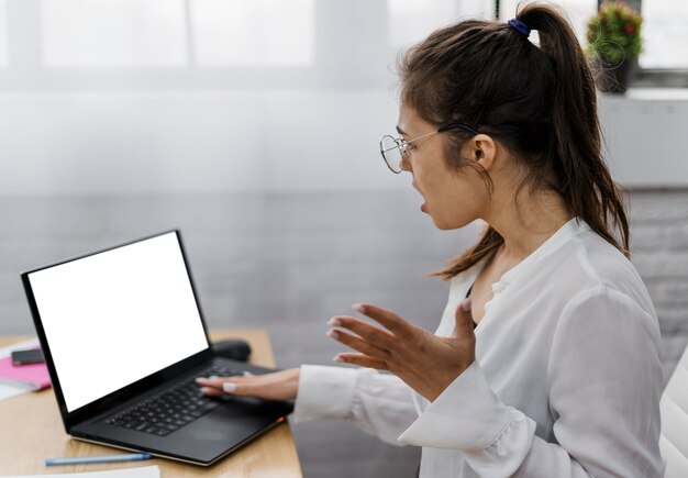 Frustrated young woman working from home