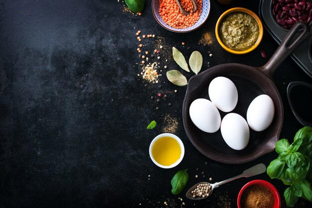 Frying pan empty and assorted spices and eggs