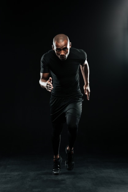 Full body photo of afro american running man