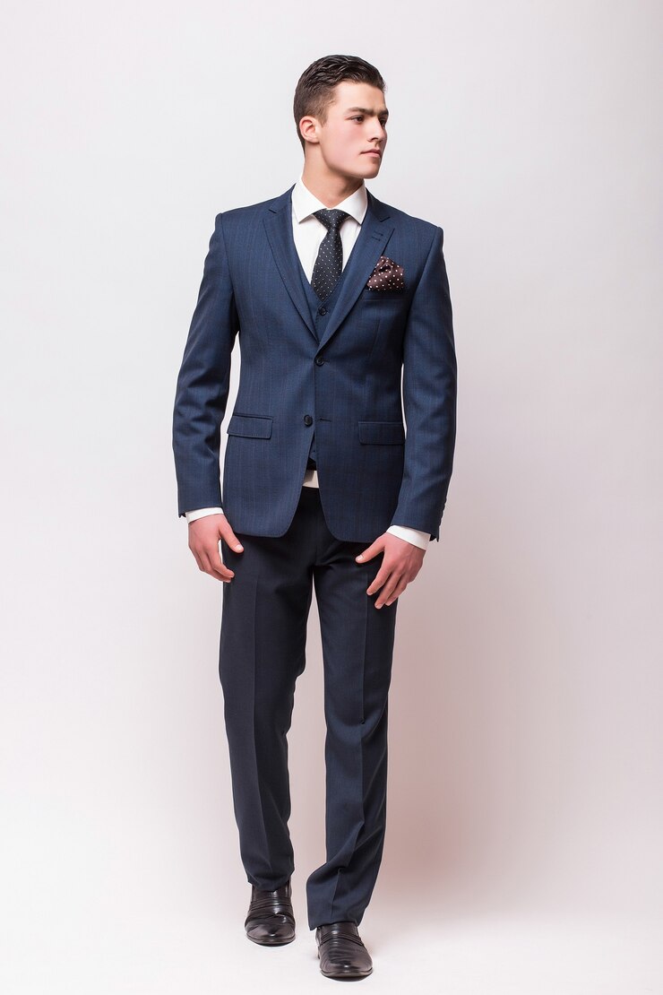 Free Photo full body portrait of a businessman in suit standing on isolated white wall