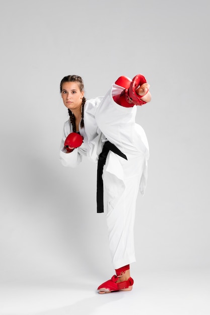 Full body of woman with box gloves on white background