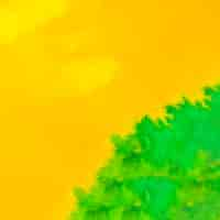 Free photo full frame of bright yellow and green watercolor backdrop