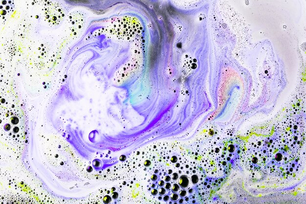 Full frame of colored bath bomb surface with bubbles