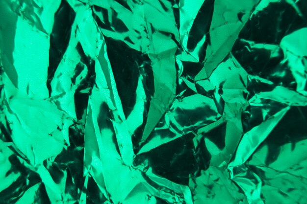 Full frame of crumpled wrapped green paper