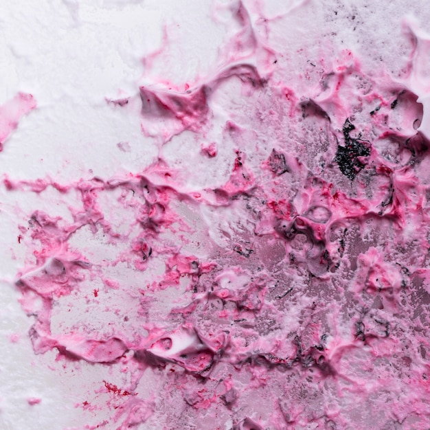 Full frame of messy textured pink and white foam background