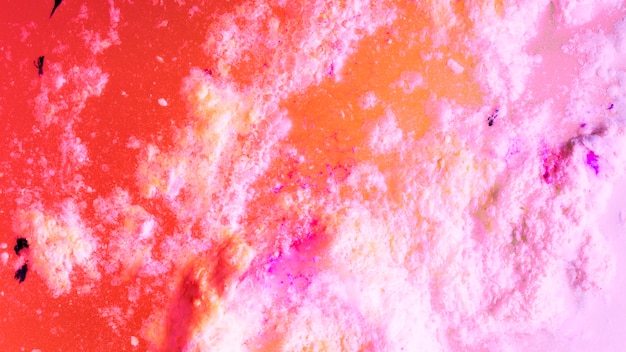 Full frame of red and pink bath bomb foam