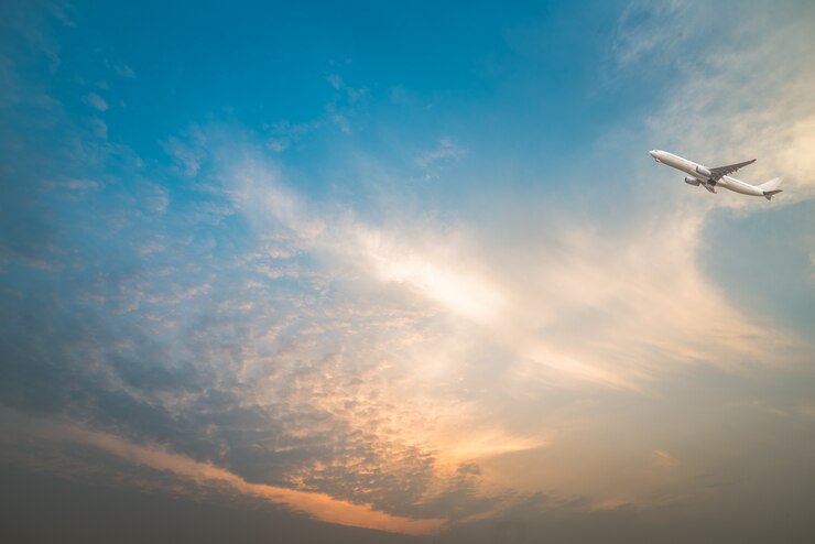 Free Photo full frame shot of  cloudscape with a plane flying over