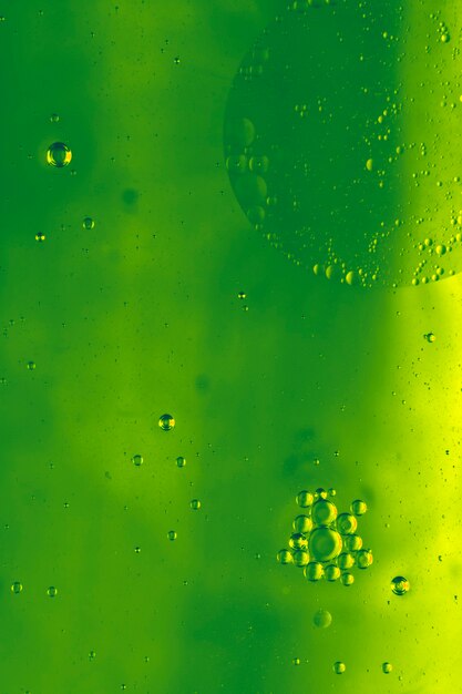 Full frame shot of green background with oil bubbles