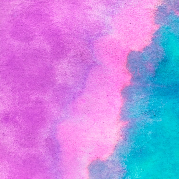 Full frame of watercolor pink and turquoise textured backdrop