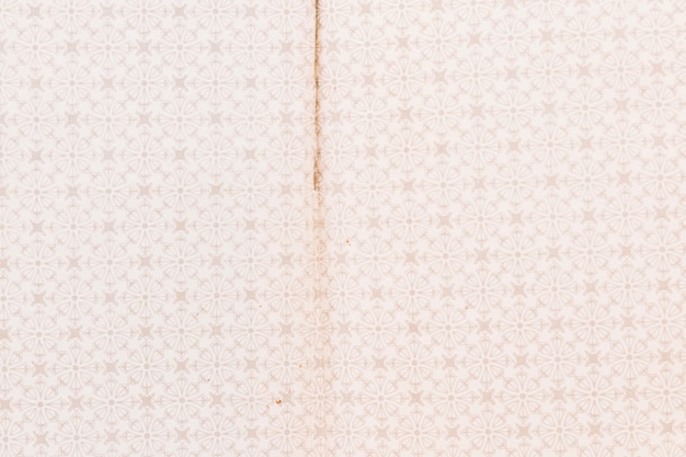 Full frame of weathered pattern wallpaper