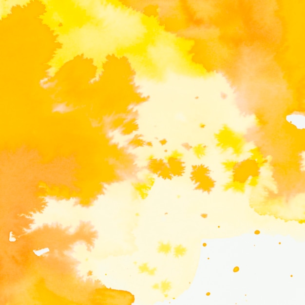 Free photo full frame of yellow and orange watercolor brush stroke and splash backdrop