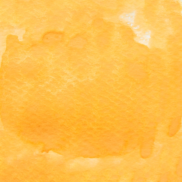 Full frame of yellow painted watercolor backdrop