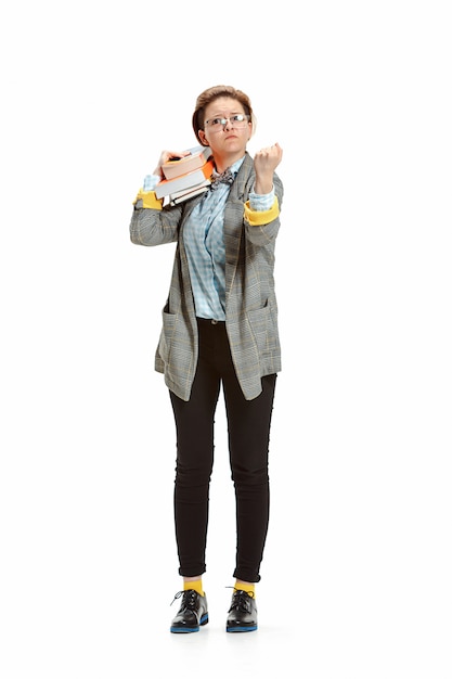 Free photo full length portrait of a angry female student holding books isolated on white space