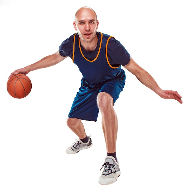 Full length portrait of a basketball player with ball