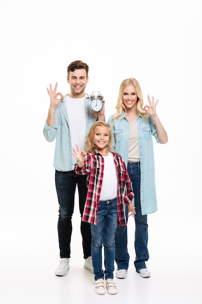 Full length portrait of a beautiful smiling family