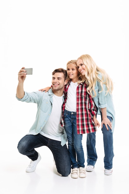 Full length portrait of a beautiful young family