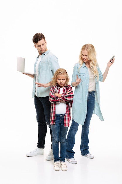 Full length portrait of a busy family having and argument