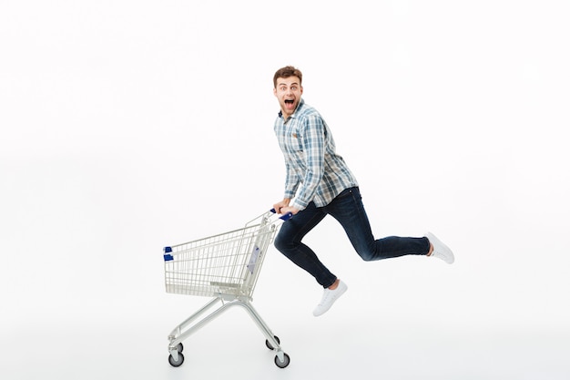 Free photo full length portrait of a cheerful man jumping