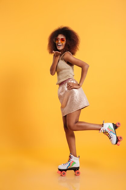 Full length portrait of a cheery afro american woman