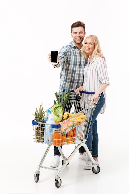 Free photo full length portrait of a cheery couple