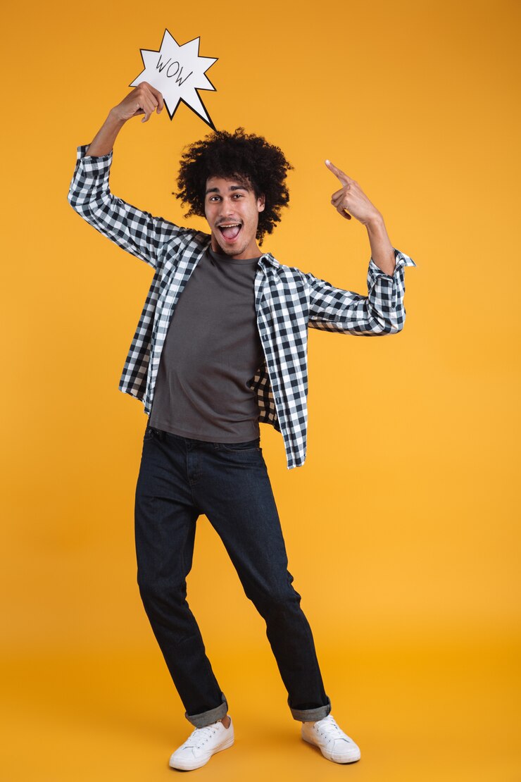 Free Photo full length portrait of an excited cheerful african man