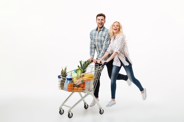 Full length portrait of a happy couple running