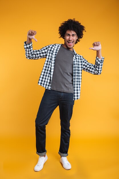 Full length portrait of a happy young african man