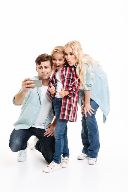 Full length portrait of a happy young family