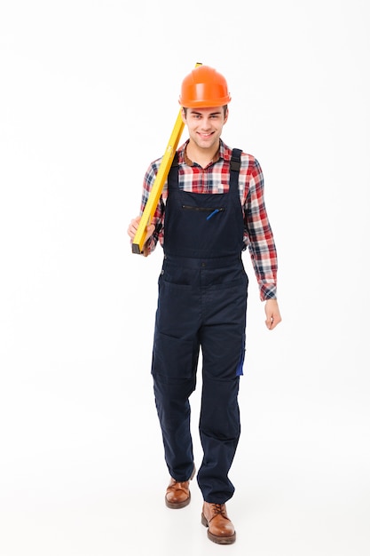 Full length portrait of a happy young male builder