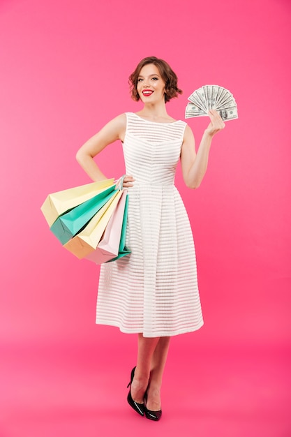 Full length portrait of a lovely girl dressed in dress