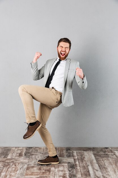 Full length portrait of a satisfied businessman