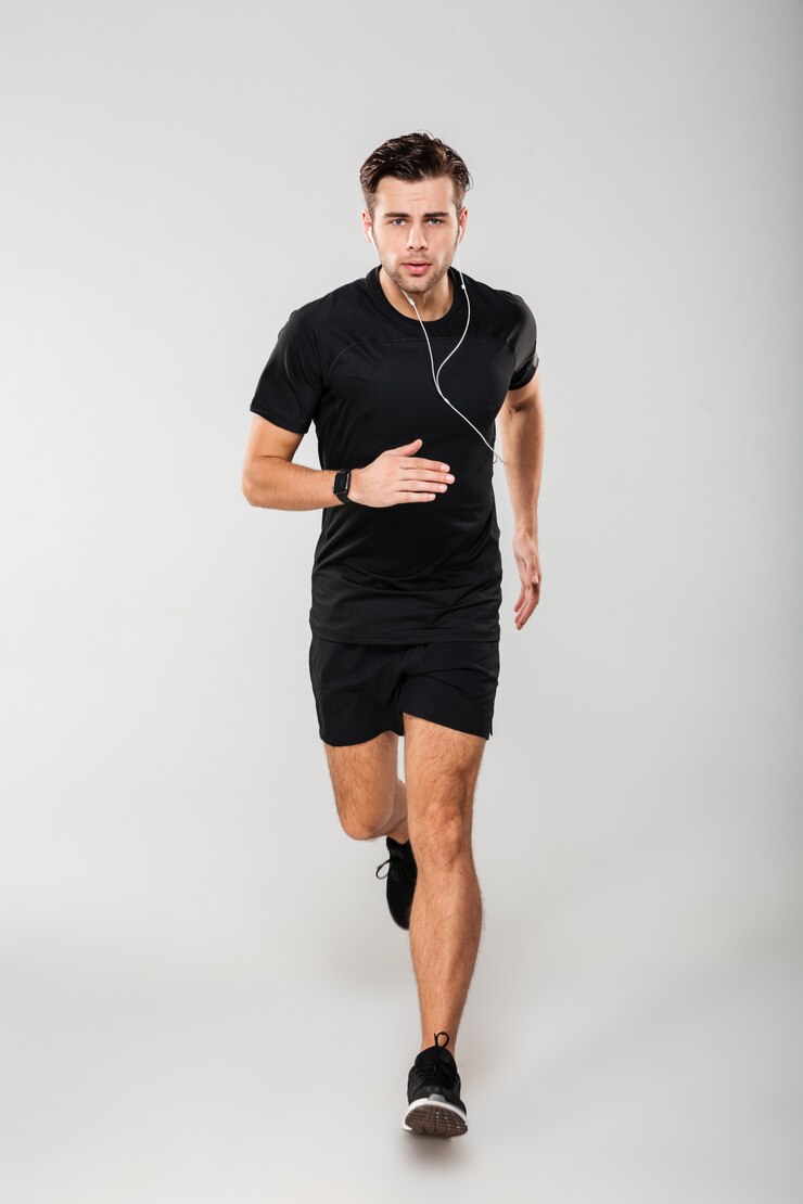 Free Photo full length portrait of a serious young man athlete