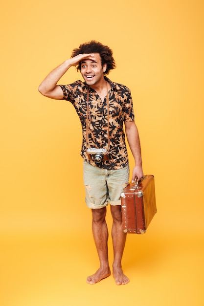 Full length portrait of a smiling afro american man