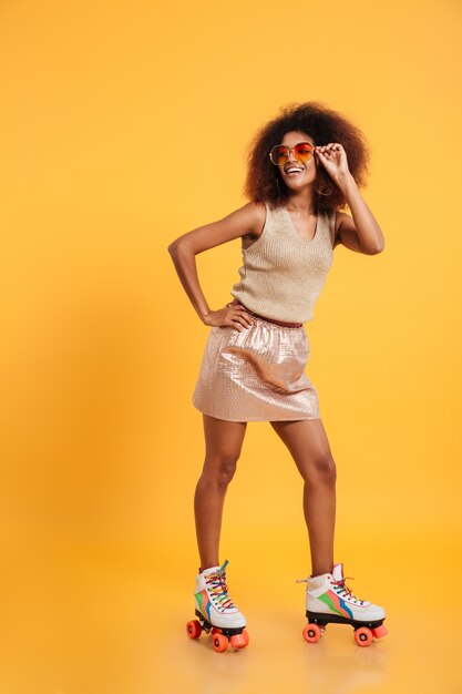 Full length portrait of a smiling afro american woman