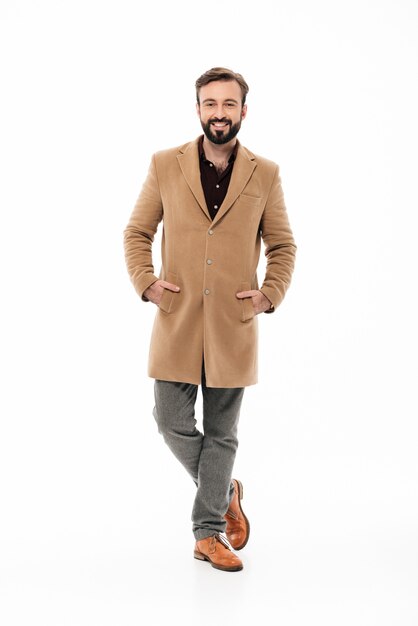 Full length portrait of a smiling bearded guy