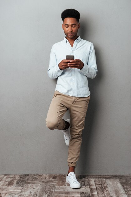 Full length portrait of a young afro american man