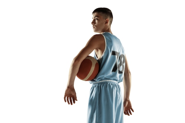 Full length portrait of young basketball player with a ball isolated on white  space