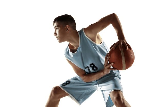 Free photo full length portrait of young basketball player with a ball isolated on white